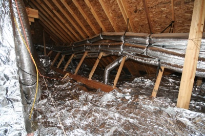 Radiant Barrier Foil shown over attic insulation
