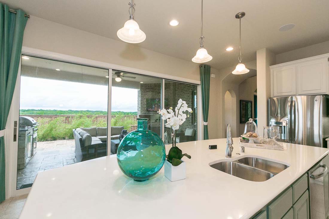 Sliding doors lead to patio in Chesmar home