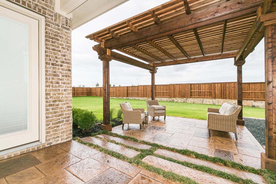 Covered backyard patio in Chesmar home