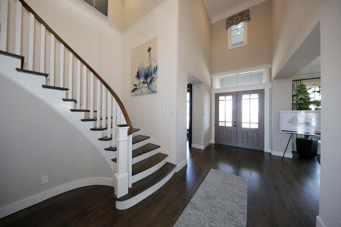 Spacious entry way and winding stairwell in Southgate home